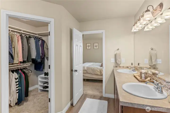 Walk in closet in the primary bath