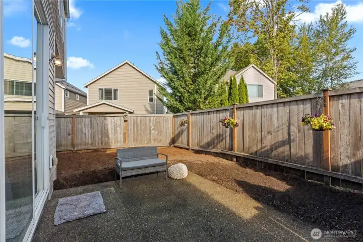 The back yard is small but mighty!  This is a blank slate ready for your creativity!