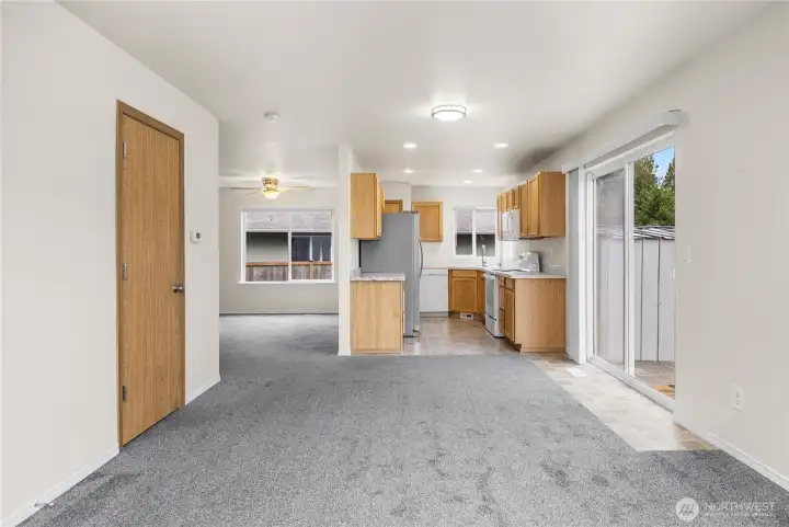 Looking from family room, half bath is door to left