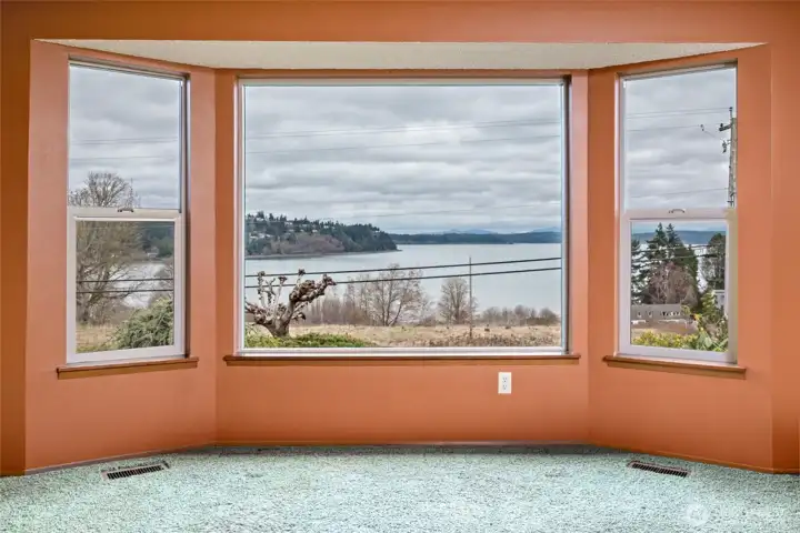 Take in the view of Skagit Bay. To the left Mt. Baker is hiding behind the clouds.  Entire home has  been updated with vinyl Milgard windows.
