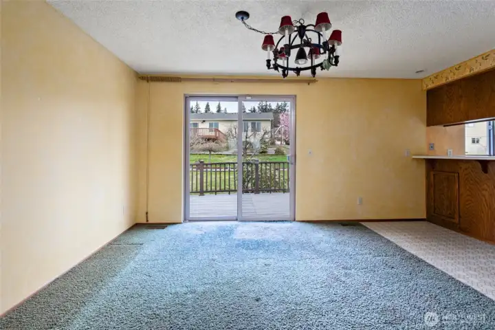 Looking into dining room from living room.  Sliders lead to back yard.