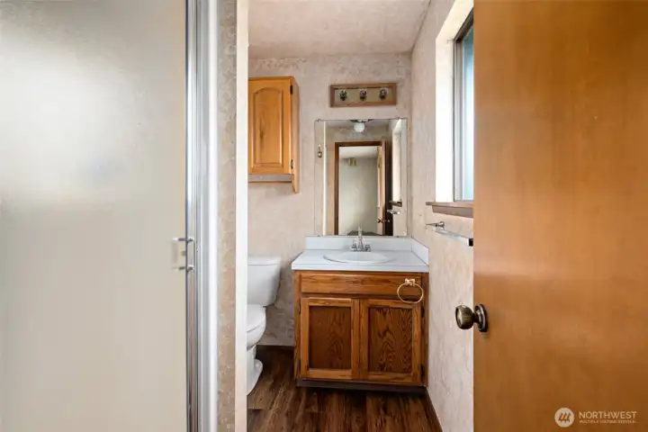 Primary 3/4 bathroom.   Main bath has same flooring.