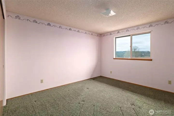 One of the 2 bedrooms , window faces front with a water view.