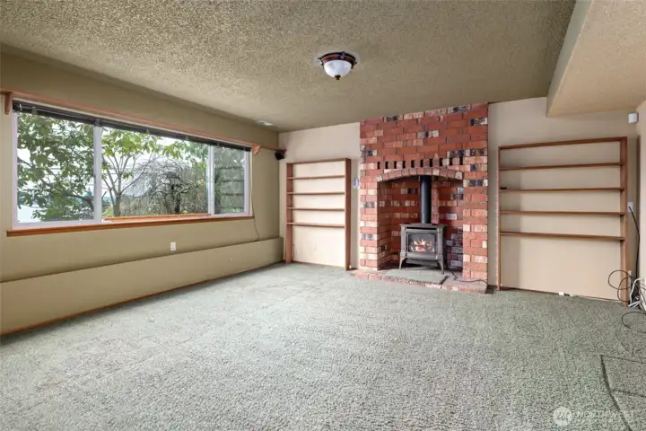 Family room /guest suite you decide.  Lopi free standing propane stove.  4th Bedroom is to the right.