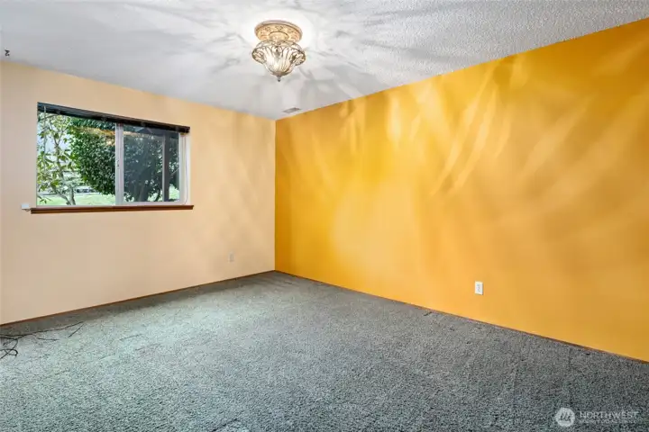 4th bedroom  window looks out at side yard.