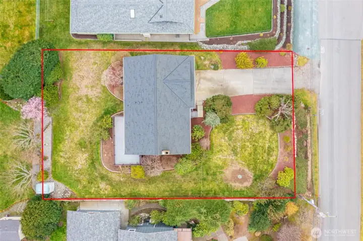 Aerial view of property, red lines for reference only. Composition roof and gutters installed  in 2024.