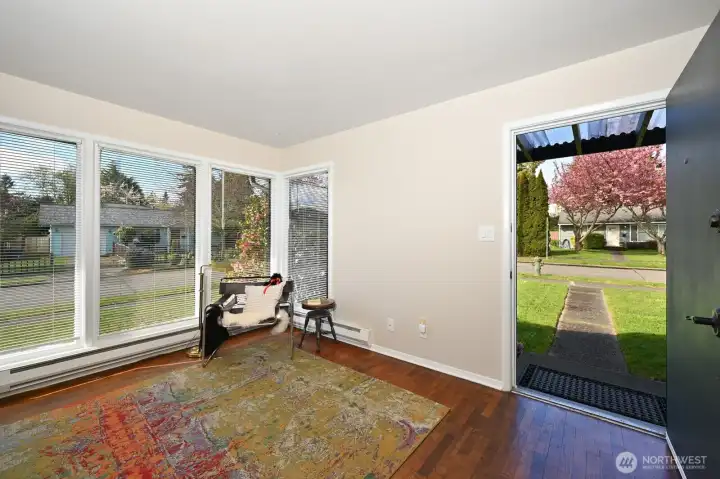 Living room with large windows for abundant light.