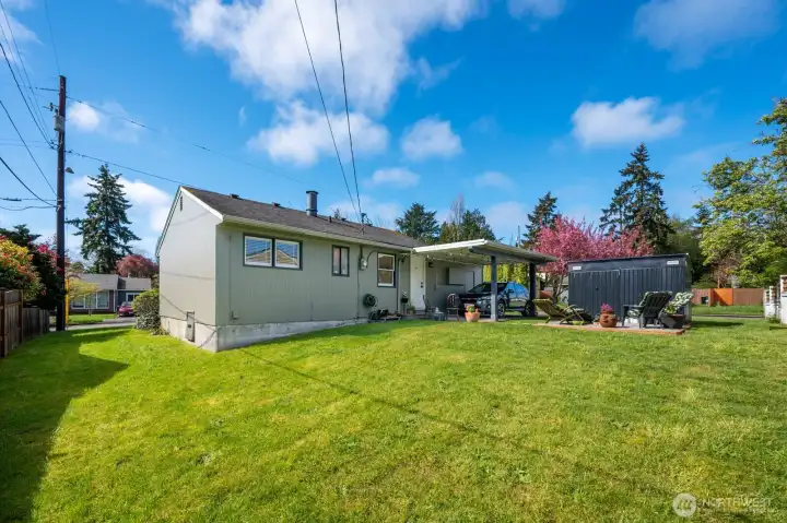 Backyard with plenty of room for parking toys, planting a garden, fencing it off completely for more space.