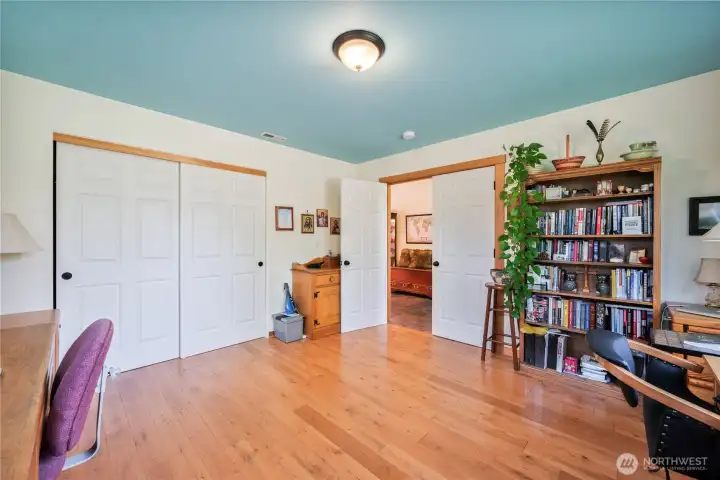 A large closet, double door entry and another look at the beautiful oak floors!