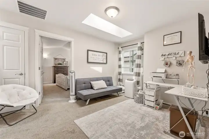 As you head upstairs, you will find this generous loft/landing area! Perfect for gaming, homework, another TV, home office...the skylight is a real plus.