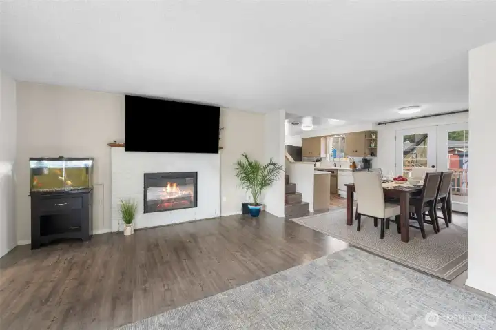 Living room has an electric fireplace with blower for warmth