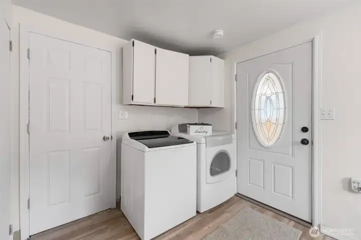 Laundry area right off the kitchen with door leading to dog run.