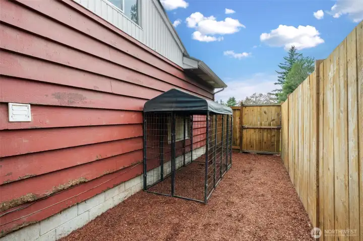 Dog run right off the side entry ready for your pup.