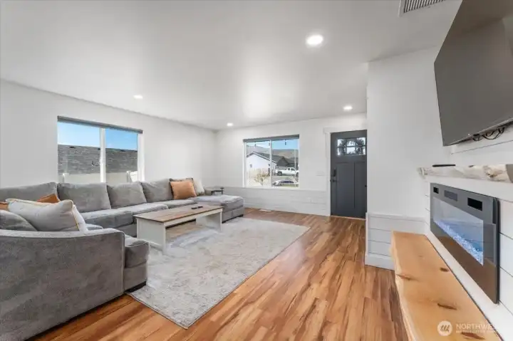 Fully updated, with LVP flooring/electric fireplace and raw edge mantel