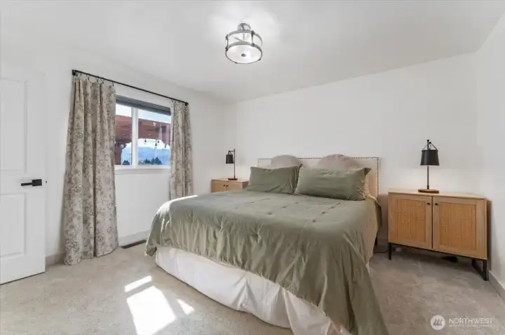 Bright and light primary bedroom with walk-in closet