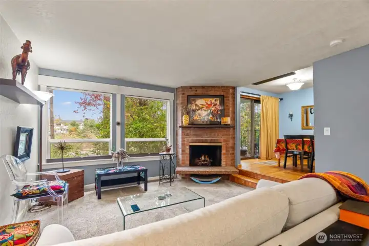 Open living room with fireplace.