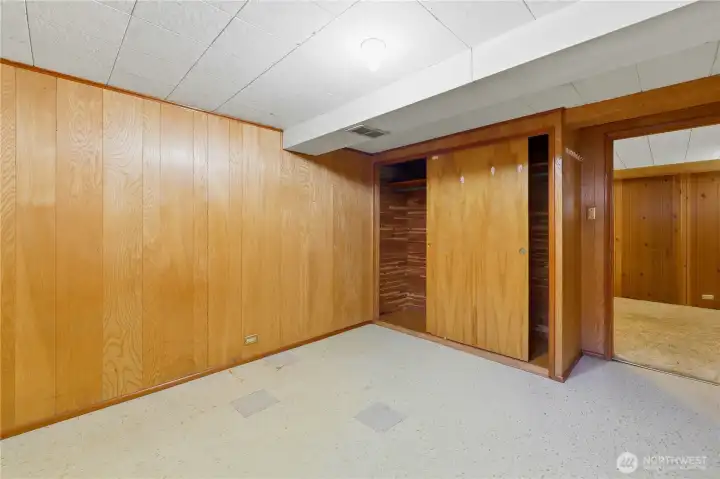 one of three rooms on lower level with a closet and small window