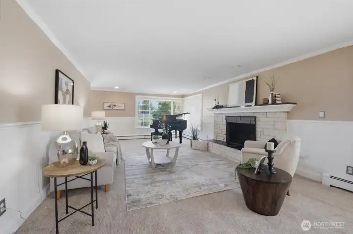 Main living area with cozy fireplace and flexible layout for entertaining.