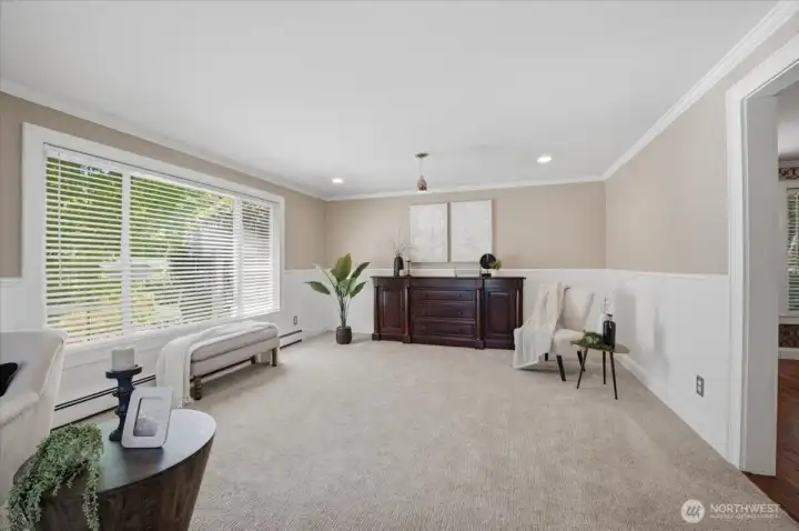 Additional living space with oversized windows and neutral finishes.