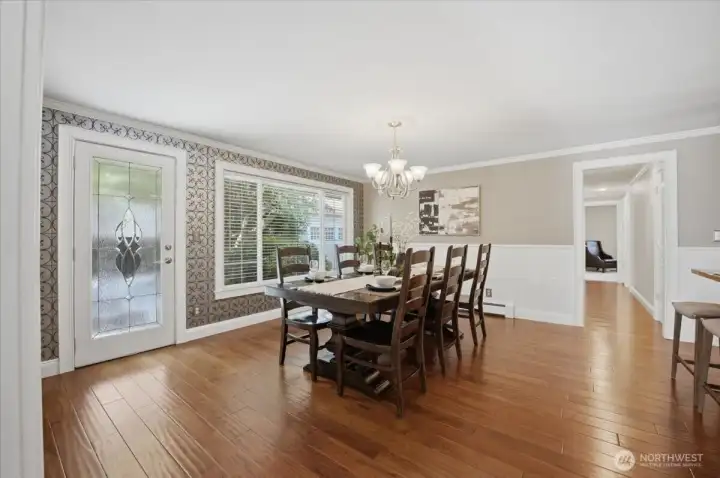 Formal dining room with hardwood floors and easy access to the kitchen.