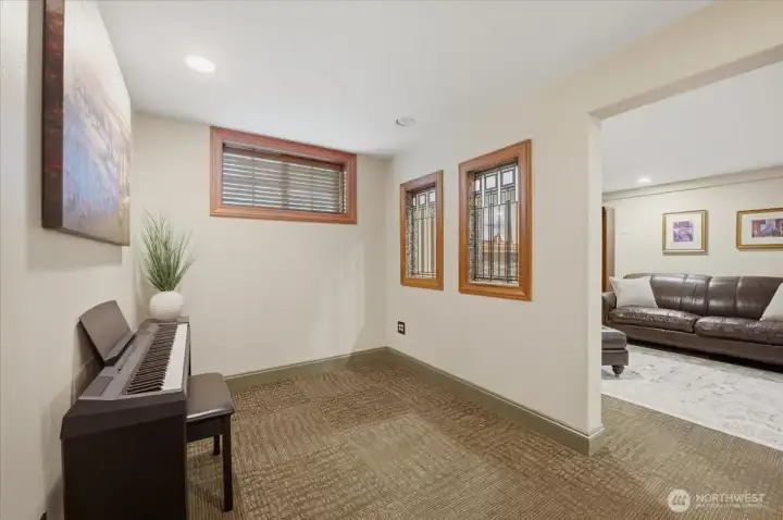 Lower-level flex space perfect for a sitting room, reading nook, or home office.