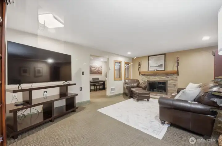 Additional room with fireplace and ample room for entertaining.