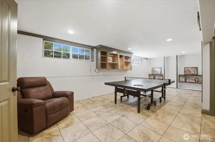 Large recreation room with durable flooring and flexible use options.