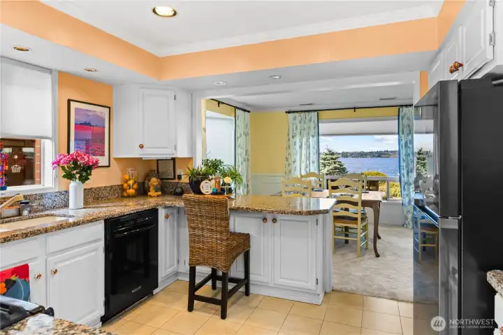 Gourmet kitchen that includes modern appliances, even has a garbage compacter.