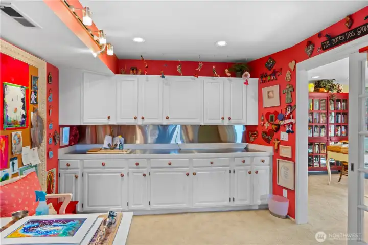 Note all of the cabinets in the bonus room.