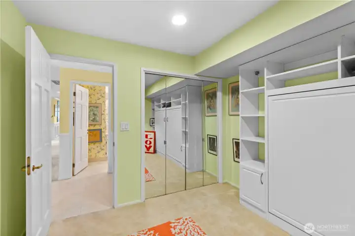 Guest bedroom with queen Murphy bed that can double as a second office.