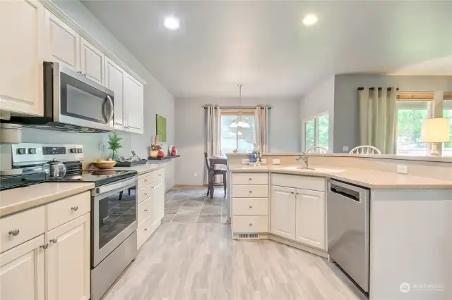 Wonderful kitchen with lots of cabinets & countertop space. Quartz counters, LVP flooring, stainless steel appliances, pantry & more