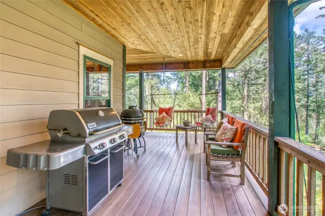 Wrap around cover decking off main level. This area is off the kitchen. Entertain guests with your new bbq or sit peacefully and enjoy mother nature up close.