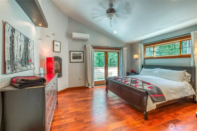 Main bedroom with french doors to private deck. Vaulted ceiling with fan, plenty of light.