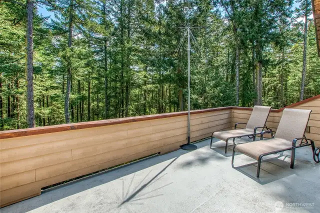 Main ensuite's private deck over looks the natural forest.