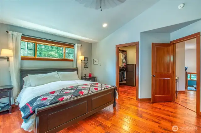 The natural wood finishes compliment and bring in the details of the natural surroundings of the home. Walk through closet to the left.