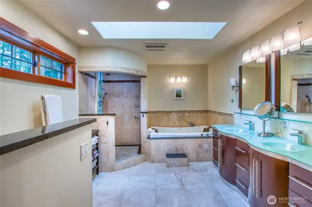 Main ensuite has everything you need to pamper yourself- walk-in rain shower with body jets, Jacuzzi Allusion tub, skylights for natural light, double sink for two.