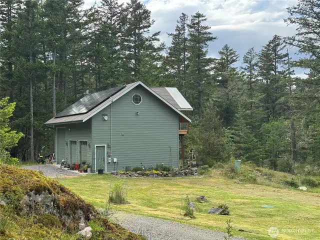 2 car garage with large RV bay, shop, laundry, upper ADU guest studio.