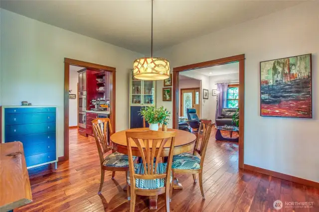 These rooms are separated by wide doorways giving the main floor an open floor feeling. Kitchne to the left, living room to the right. Etched glass sliding doors close between the dining and living room (shown closed here- be sure to check it out and get curious while your veiwing the home in person).