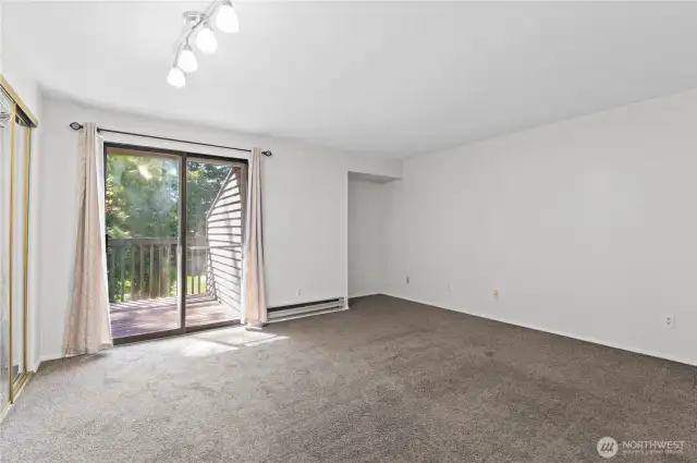 Primary bedroom with slider leading to private deck.