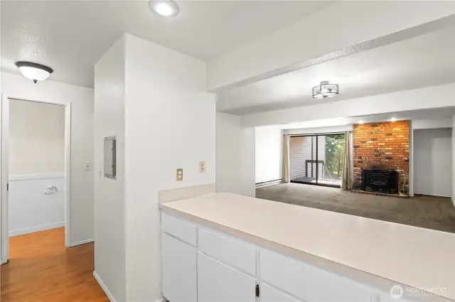 Large eating bar overlooks the dining and living area.