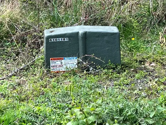 Power transformer located off Beach Ct near the NE corner of the property.