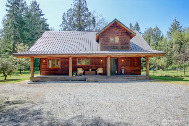 Unique log home with welcoming front porch!