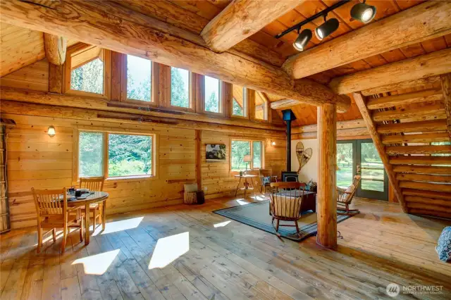 Living and dining area with French doors that open to a spacious back porch.