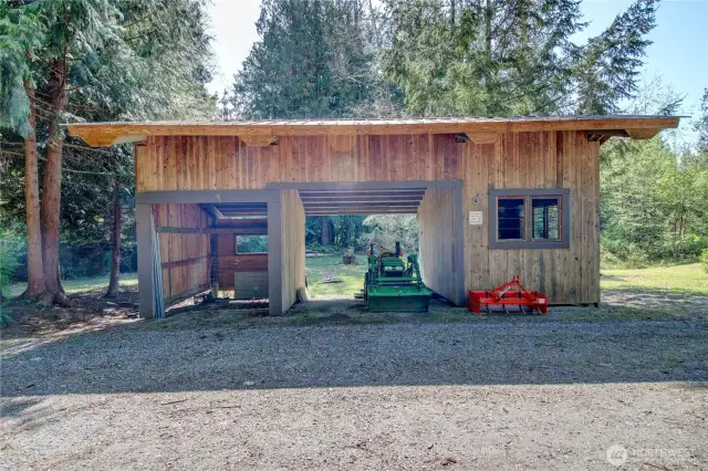 Handy machine shed with side workroom.