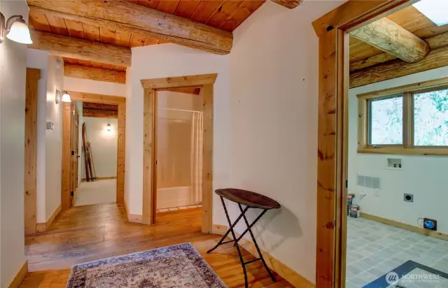Front entry way split off to laundry/utility room, main floor bathroom and bedroom.