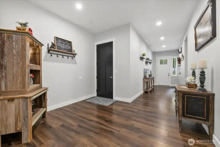 8ft 3 panel door entrance leads to extra wide hallway with 10ft ceilings throughout.