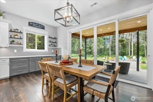 Coffee bar or extra kitchen area with shelving opens to the massive open space out back.  Room for your extra large dining table for those big gatherings.