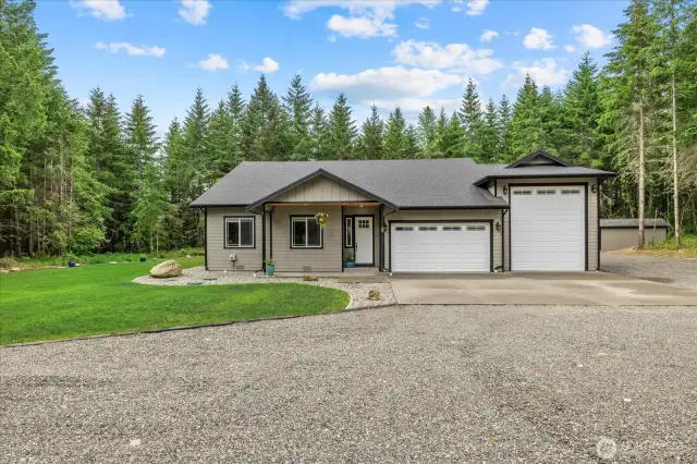 Custom built home with all the amenities.  Pull through RV bay to back as well.