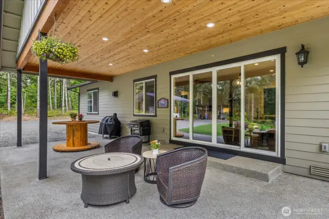 Massive covered porch with tongue and groove ceiling offers recessed lighting as well.