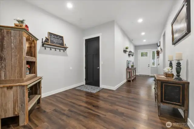 8ft 3 panel door entrance leads to extra wide hallway with 10ft ceilings throughout.